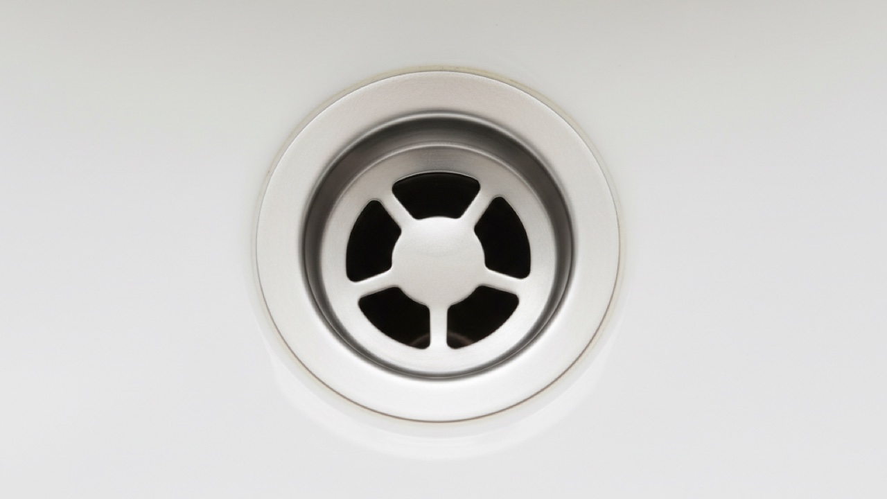 Drain after cleaning — polished stainless finish, no scale